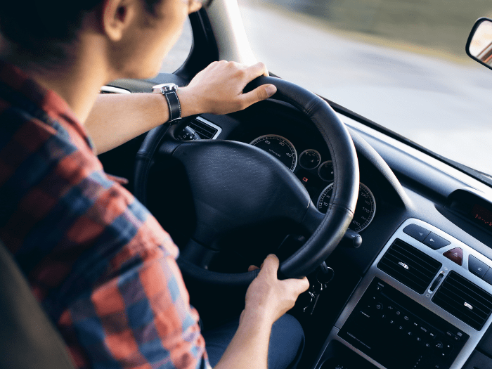 man driving in car